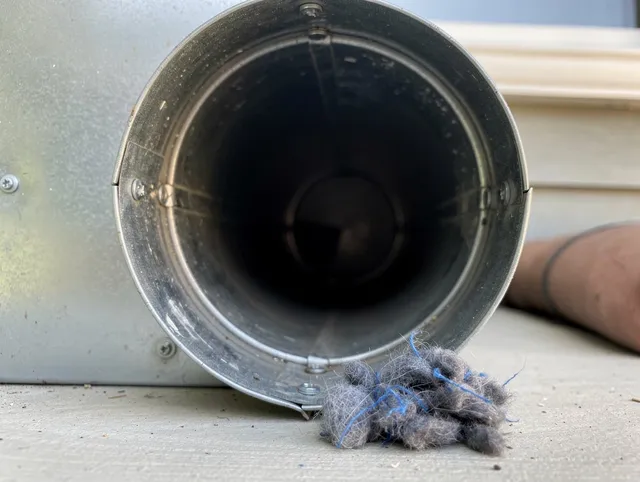 Seymour Dryer Vent Cleaning technician using specialized equipment to clear severe dryer vent blockage in Seymour
